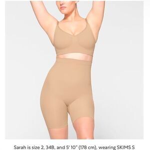 SKIMS NWT mid thigh shorts size M in the color sand